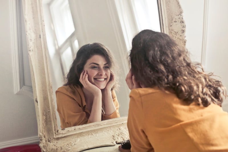 Canva-Photo-of-Woman-Looking-at-the-Mirror-2