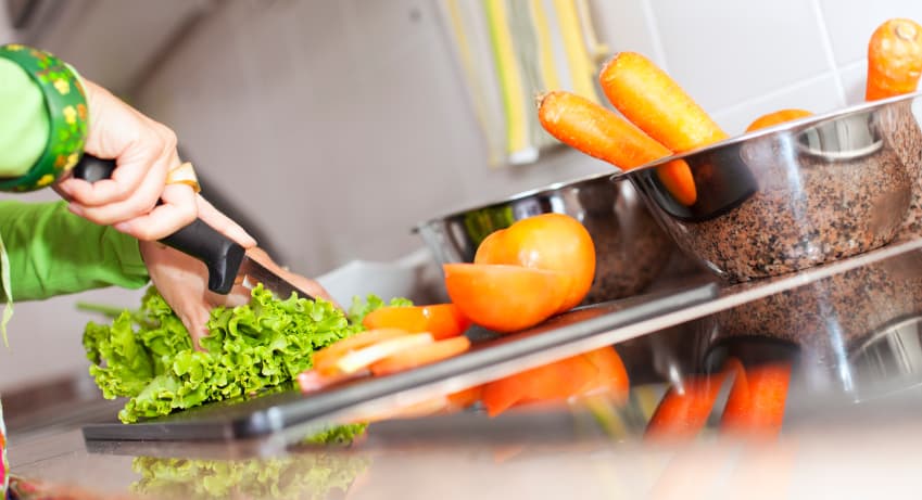 Cutting-Vegetables-In-Kitchen